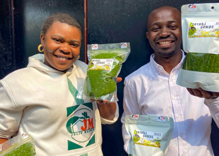 A couple who run a sombé business in Bukavu DRC showing off their packets of goods