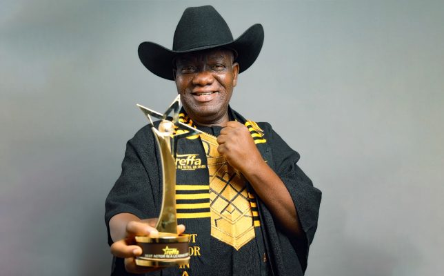 Pope Ricky, The Fisherman's lead actor, cast as Atta Ako holding a trophy after winning 'Best Actor in a Leading Role' at the Regal Film Festival And Awards (REFFA) 2025. Photo courtesy: thefisherman.film